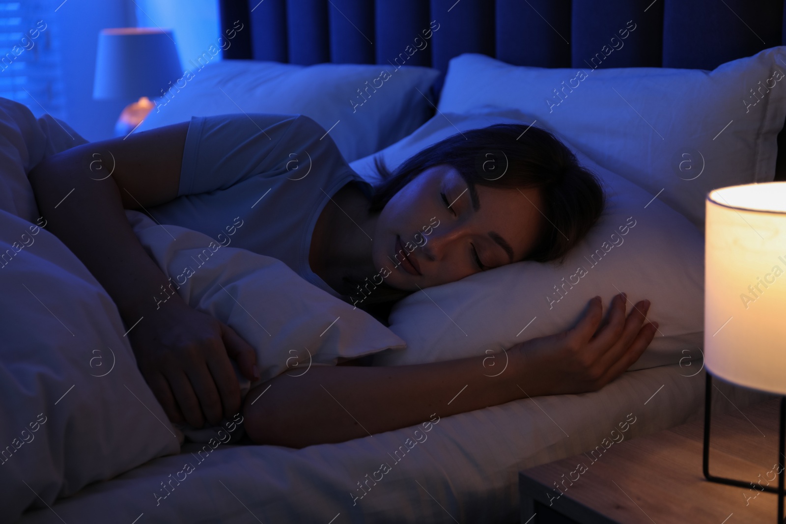 Beautiful woman sleeping in bed at home Photo of Beautiful woman sleeping in bed at home