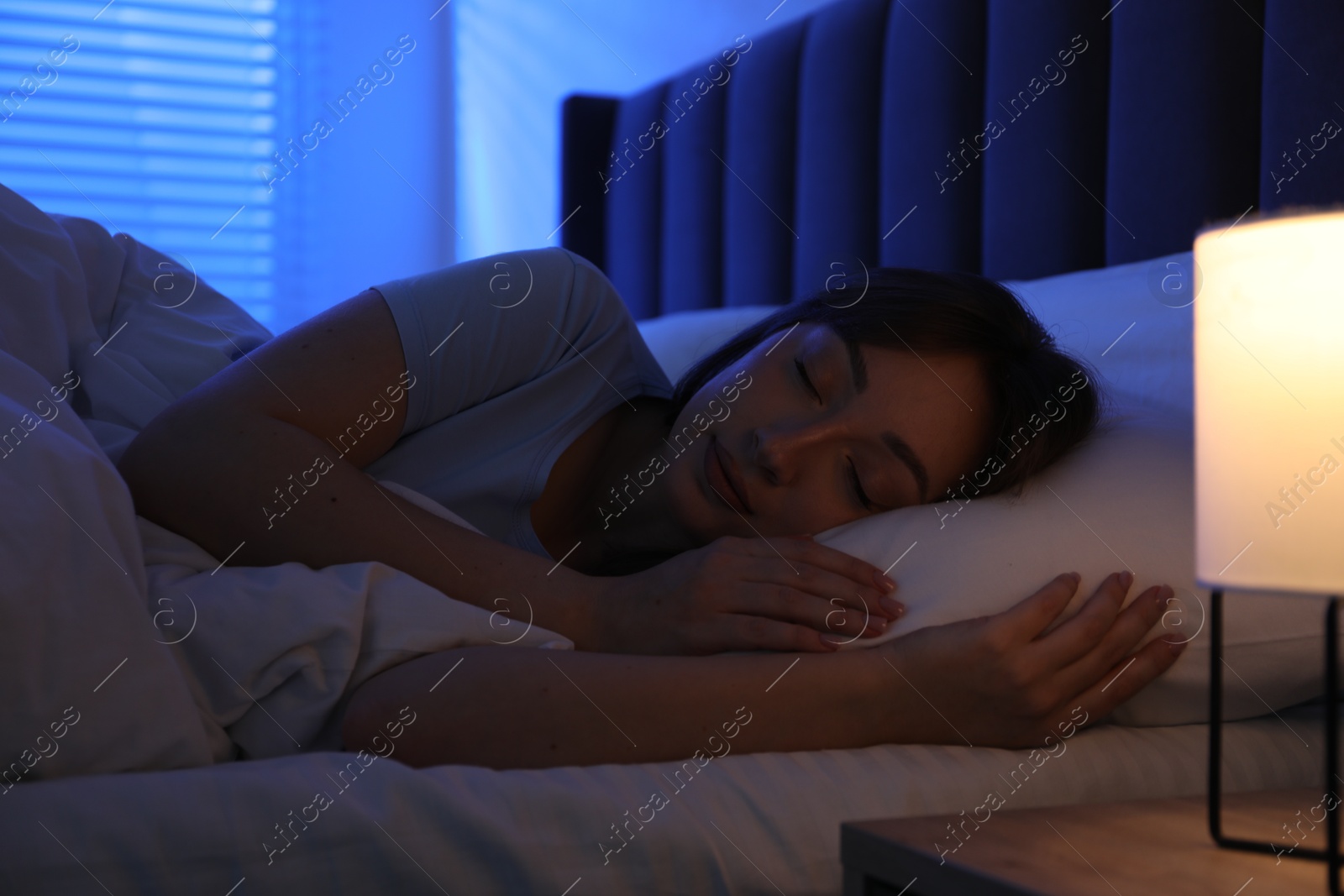 Beautiful woman sleeping in bed at home Photo of Beautiful woman sleeping in bed at home