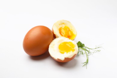 Photo of Soft boiled eggs and microgreens on white background