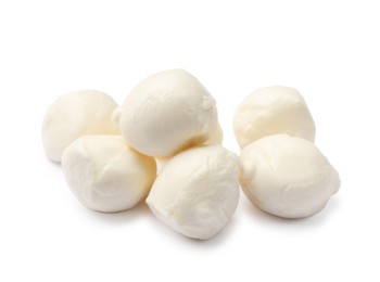 Photo of Many tasty mozzarella cheese balls isolated on white
