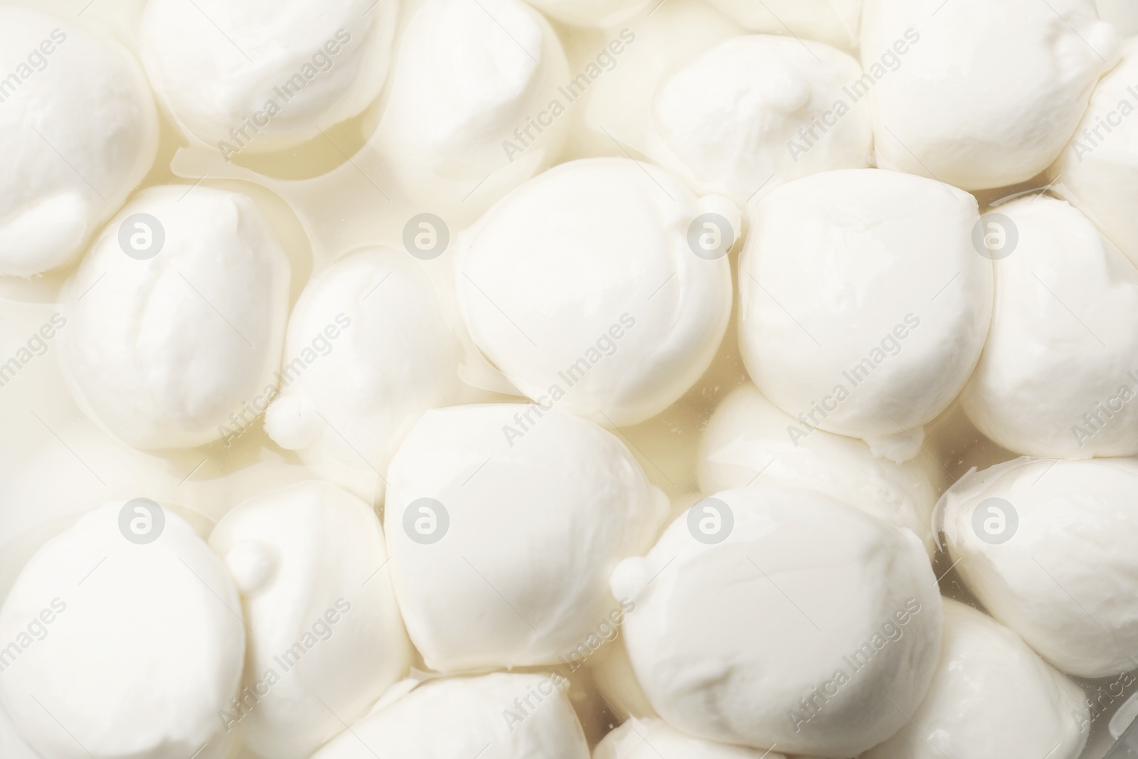 Tasty mozzarella cheese balls as background, closeup Photo of Tasty mozzarella cheese balls as background, closeup