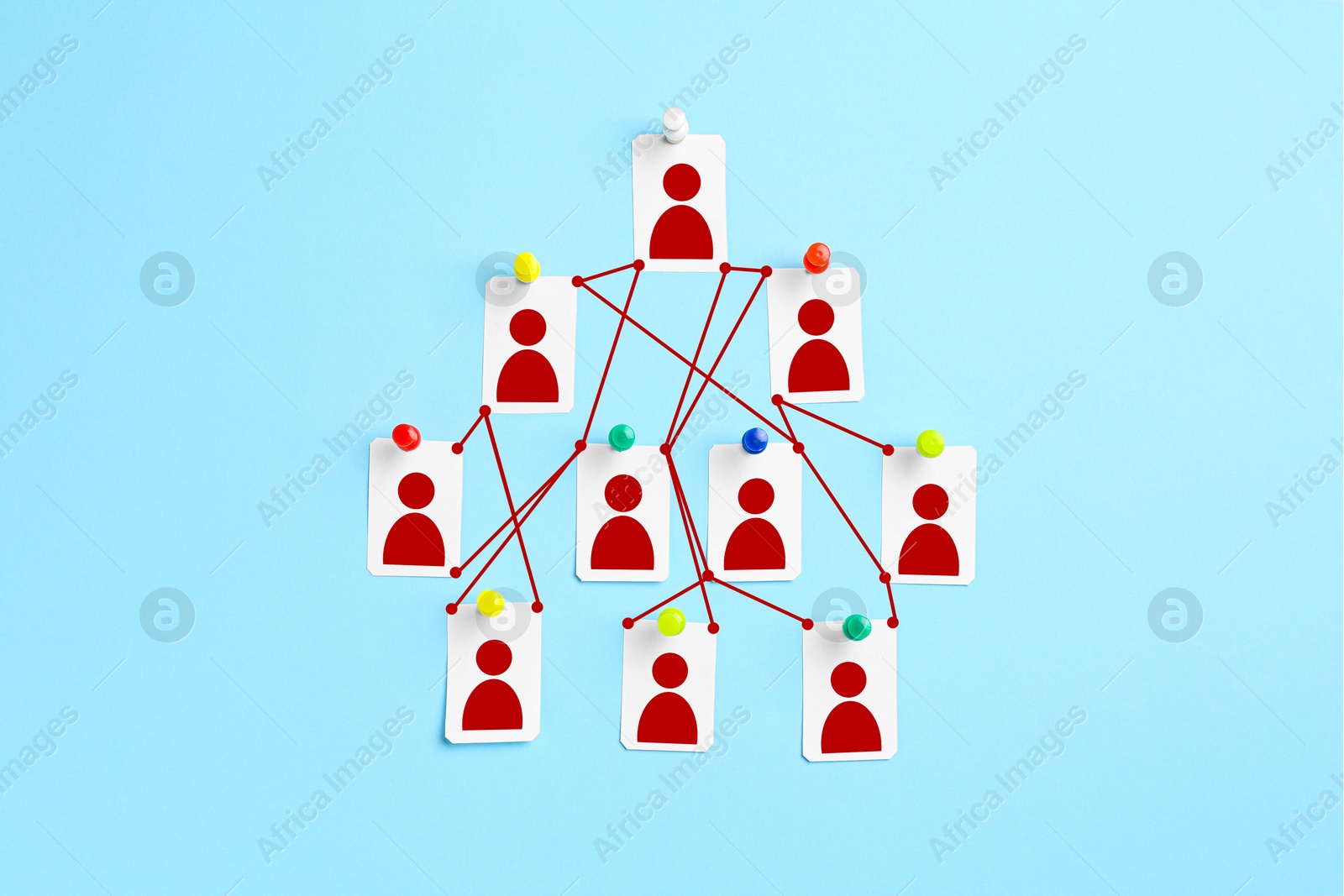 Cards with human icons pinned to light blue background and connected to each other Image of Cards with human icons pinned to light blue background and connected to each other