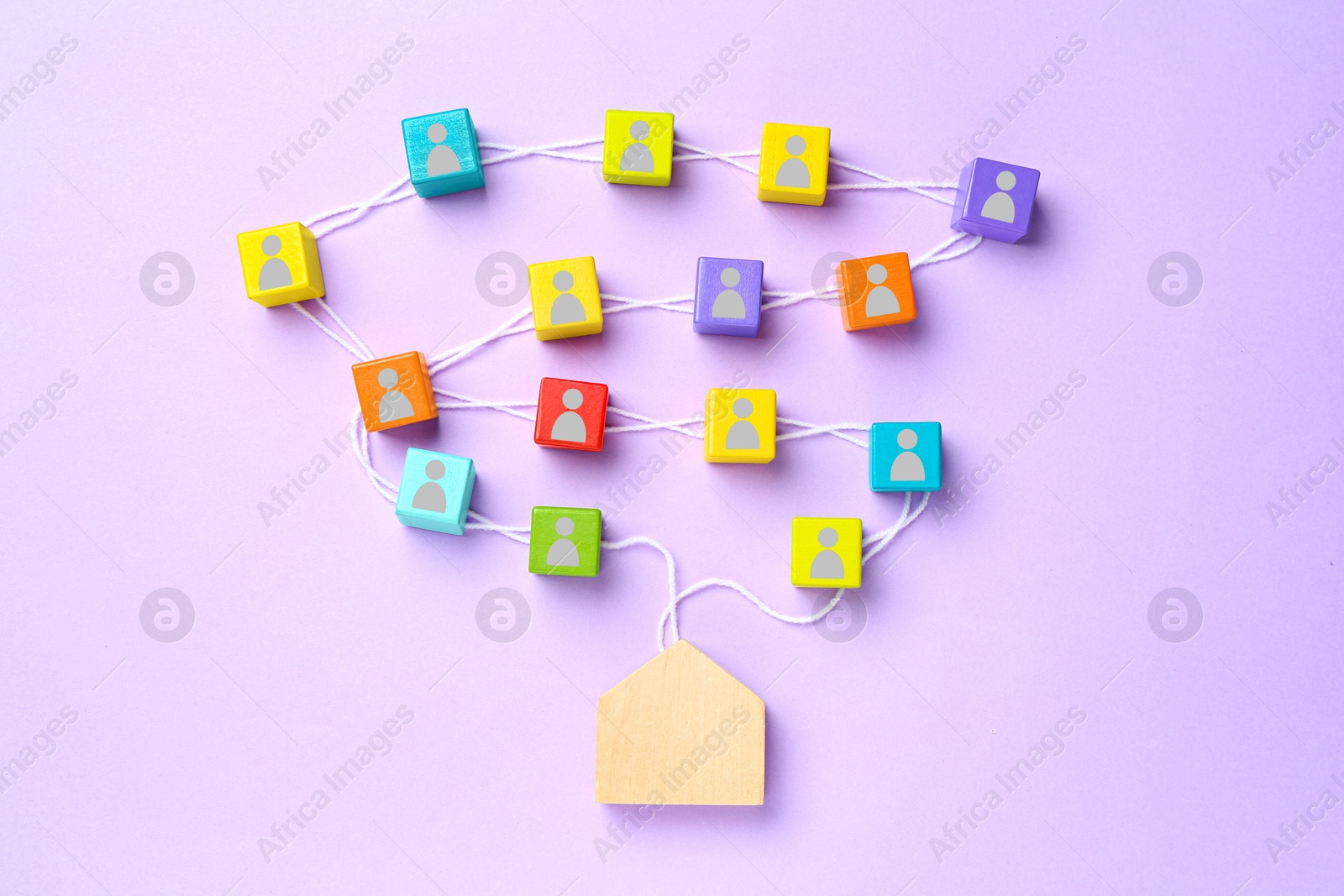 Colorful cubes with human icons on white rope leading to wooden house figure on violet background, top view. Family ties composition Image of Colorful cubes with human icons on white rope leading to wooden house figure on violet background, top view. Family ties composition