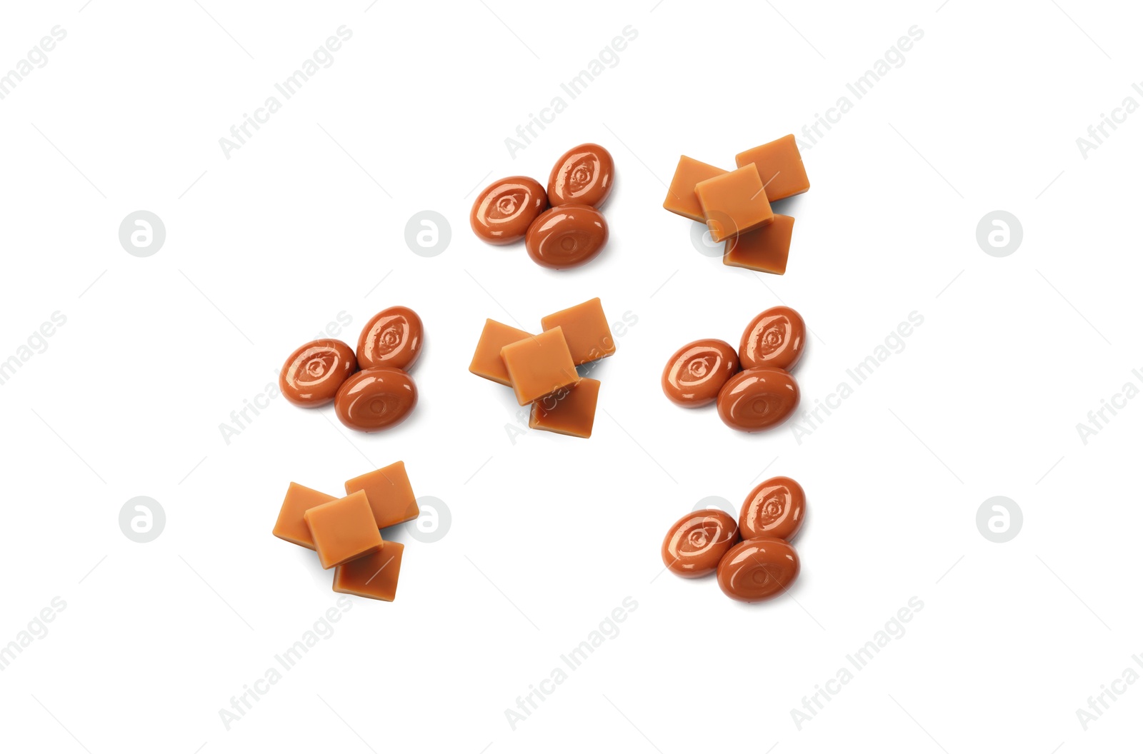 Tic-tac-toe game made of hard toffee and caramel candies on white background, top view Image of Tic-tac-toe game made of hard toffee and caramel candies on white background, top view