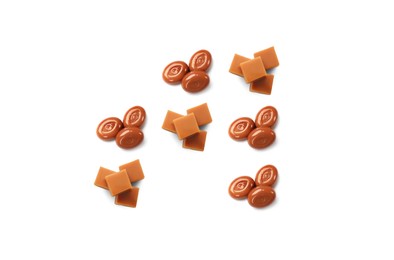Image of Tic-tac-toe game made of hard toffee and caramel candies on white background, top view