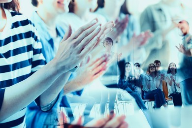 Image of Group of people applauding to speaker, double exposure