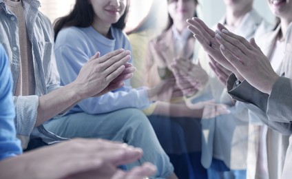 Image of Group of people applauding, closeup. Double exposure