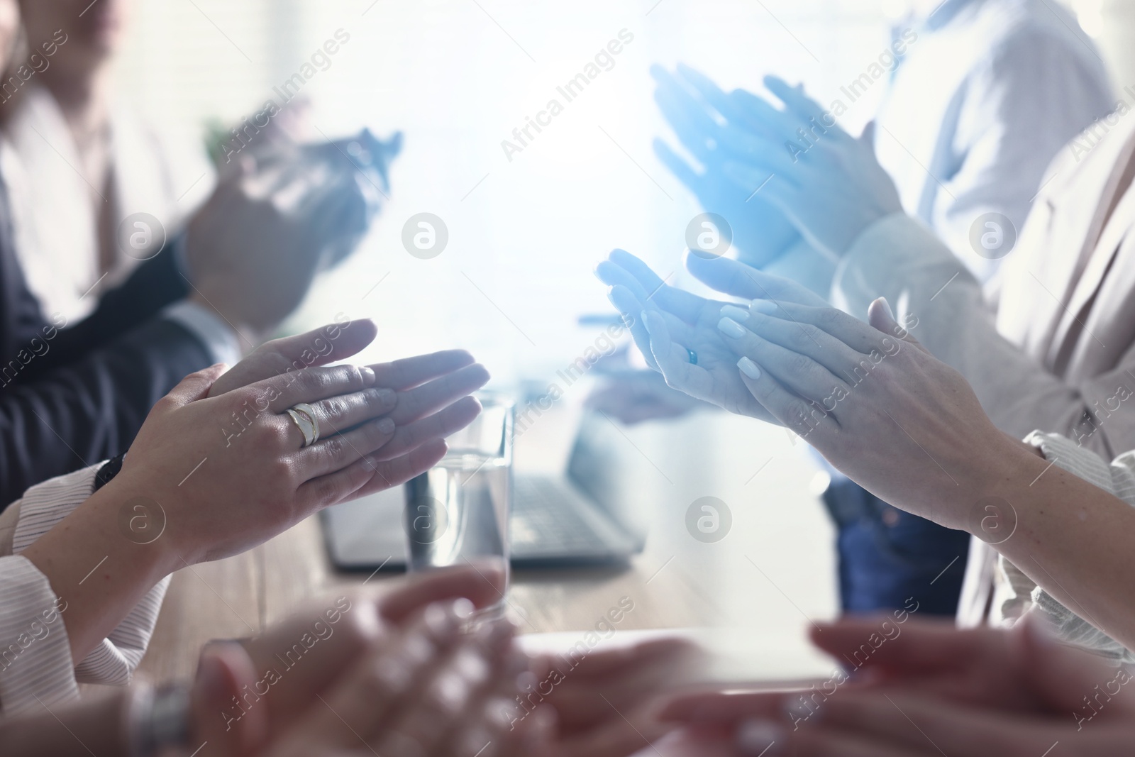 Group of people applauding over table, double exposure Image of Group of people applauding over table, double exposure