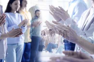 Image of Group of people applauding to speaker, double exposure