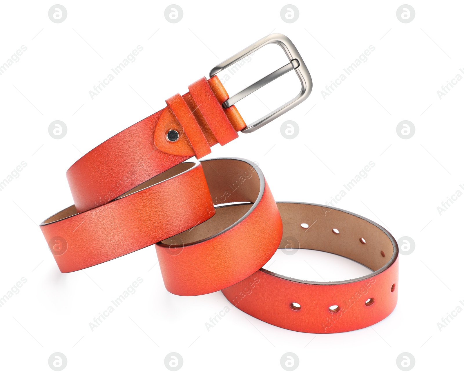 One orange leather belt isolated on white Photo of One orange leather belt isolated on white
