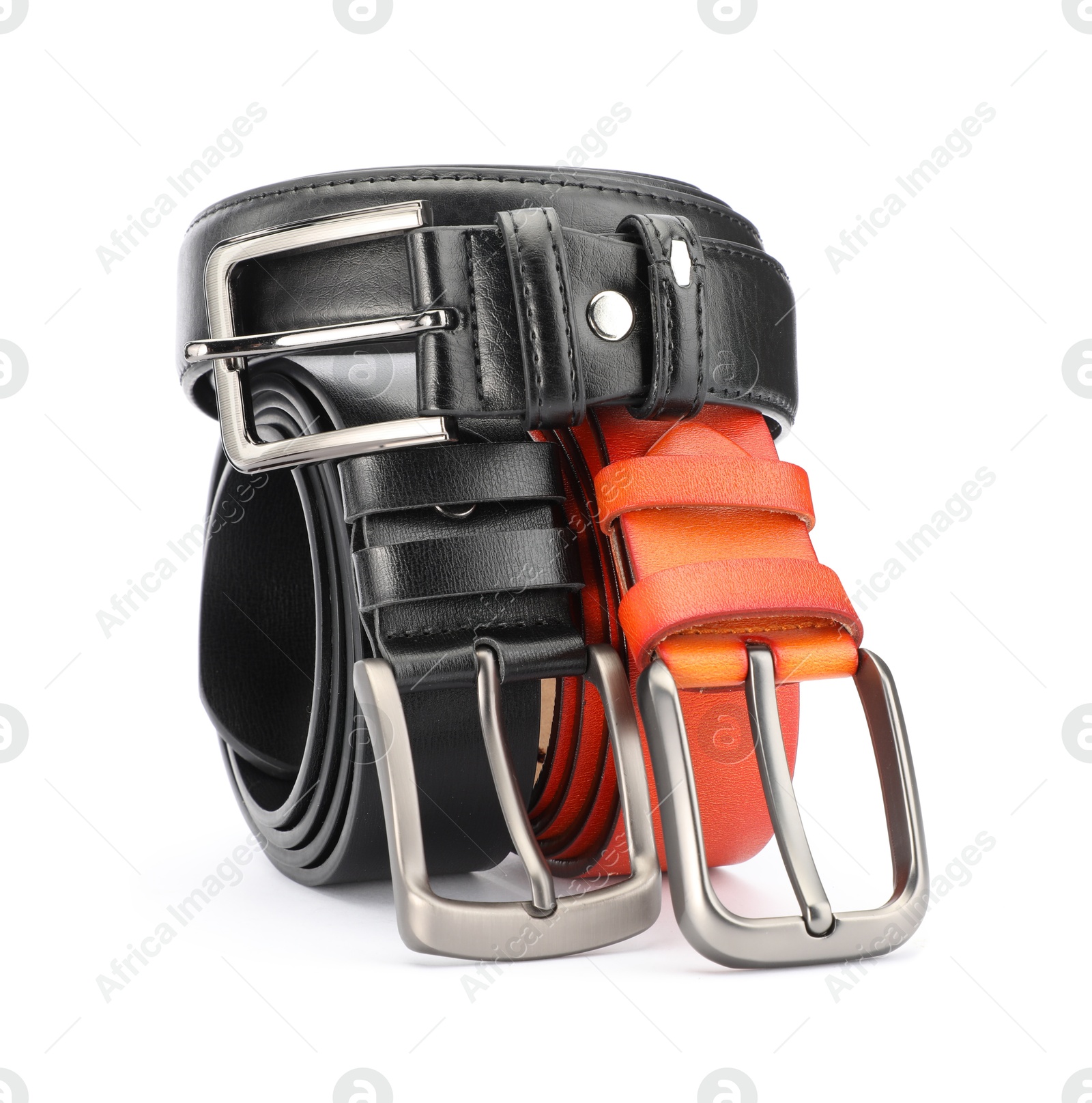 Three different leather belts isolated on white Photo of Three different leather belts isolated on white