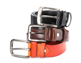 Photo of Three different leather belts isolated on white