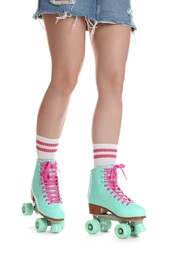 Photo of Woman in roller skates on white background, closeup