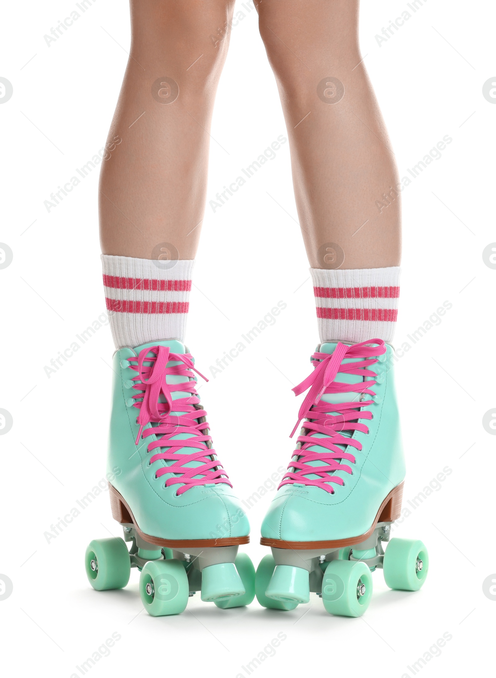 Woman in roller skates on white background, closeup Photo of Woman in roller skates on white background, closeup