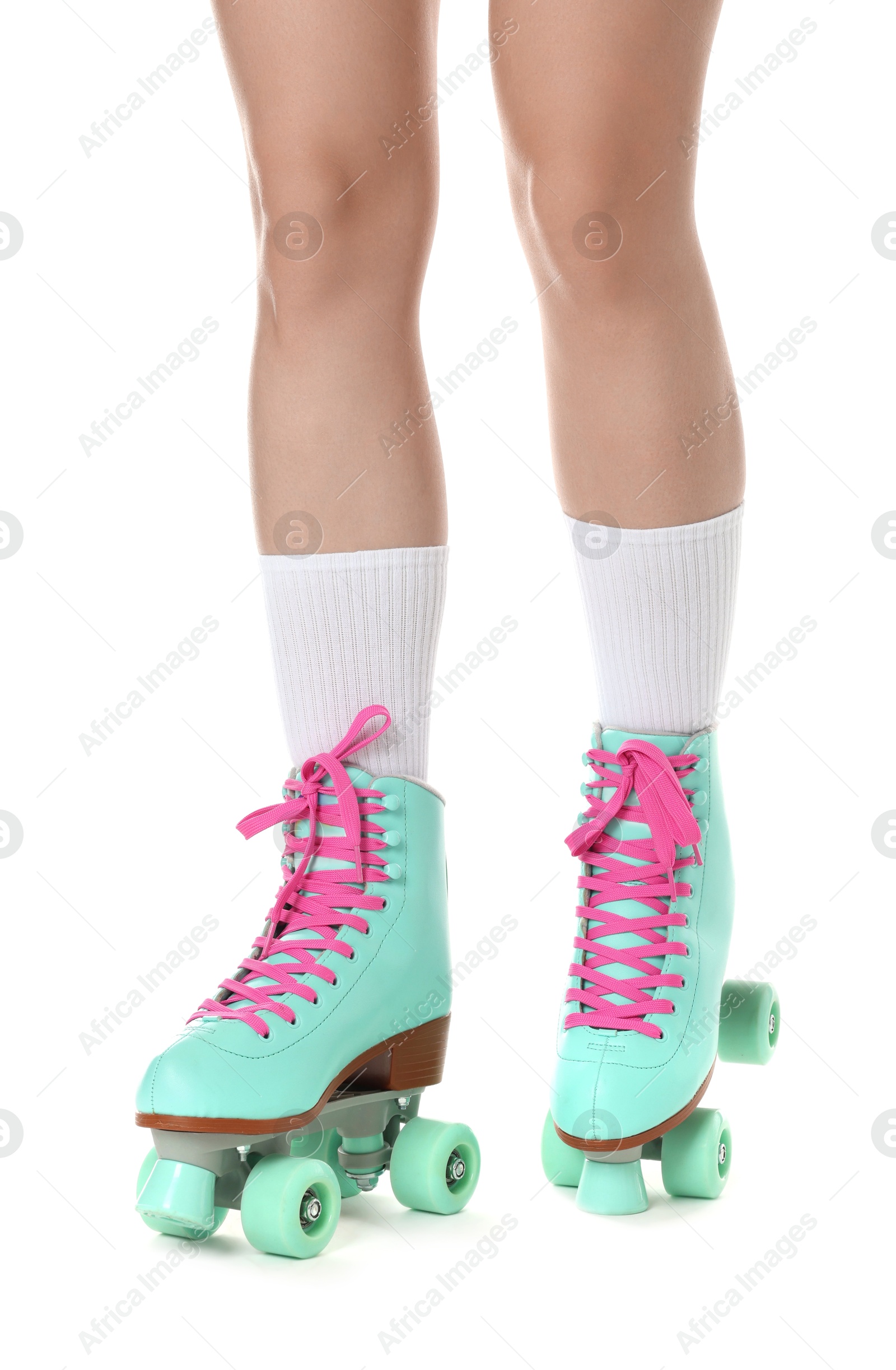 Woman in roller skates on white background, closeup Photo of Woman in roller skates on white background, closeup