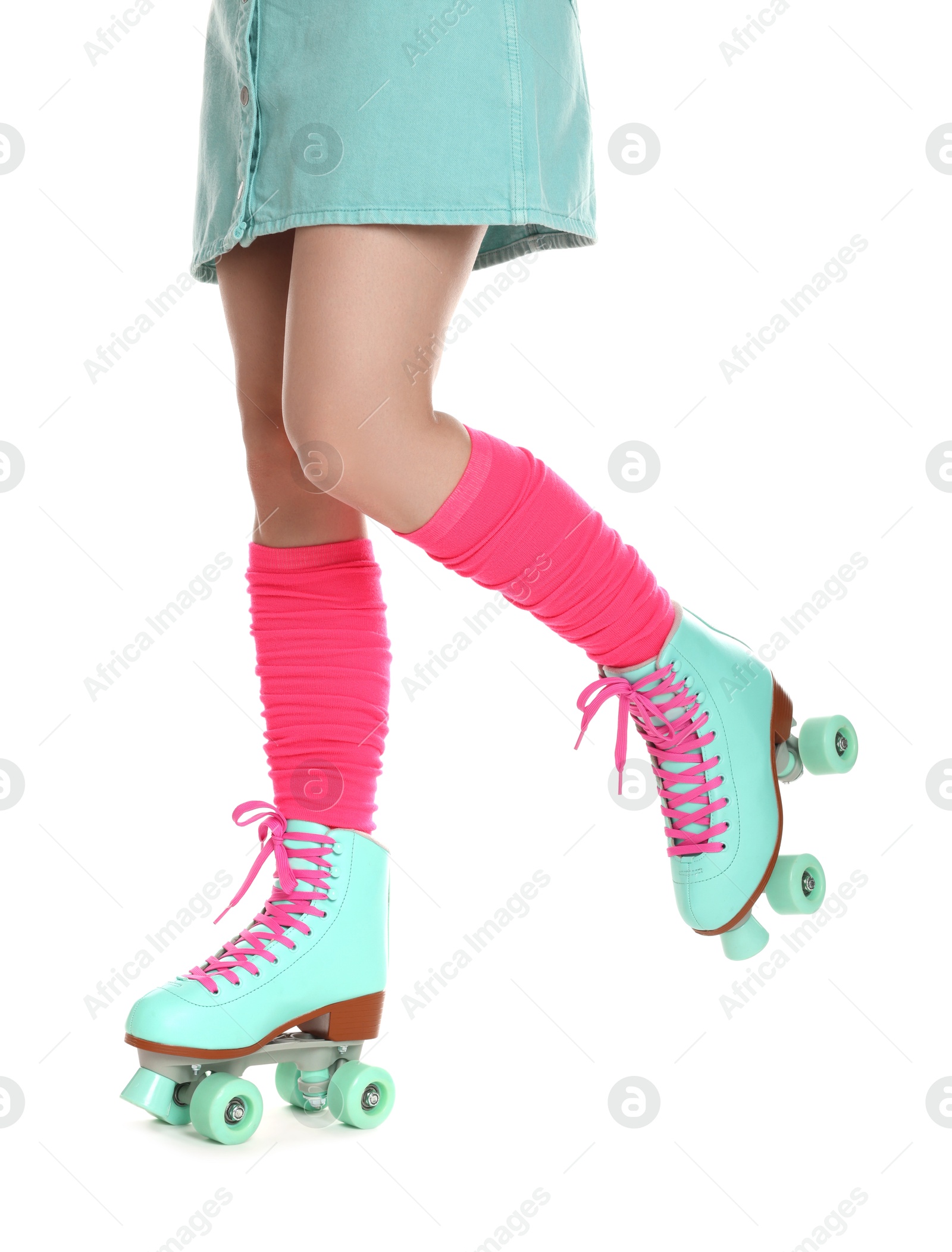 Woman in roller skates on white background, closeup Photo of Woman in roller skates on white background, closeup