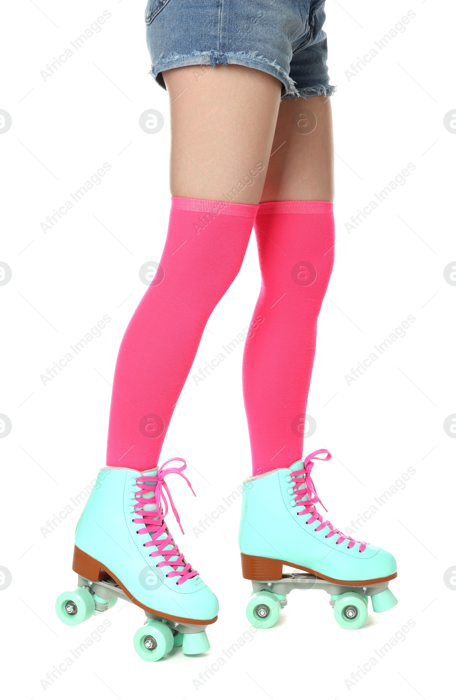 Woman in roller skates on white background, closeup Photo of Woman in roller skates on white background, closeup