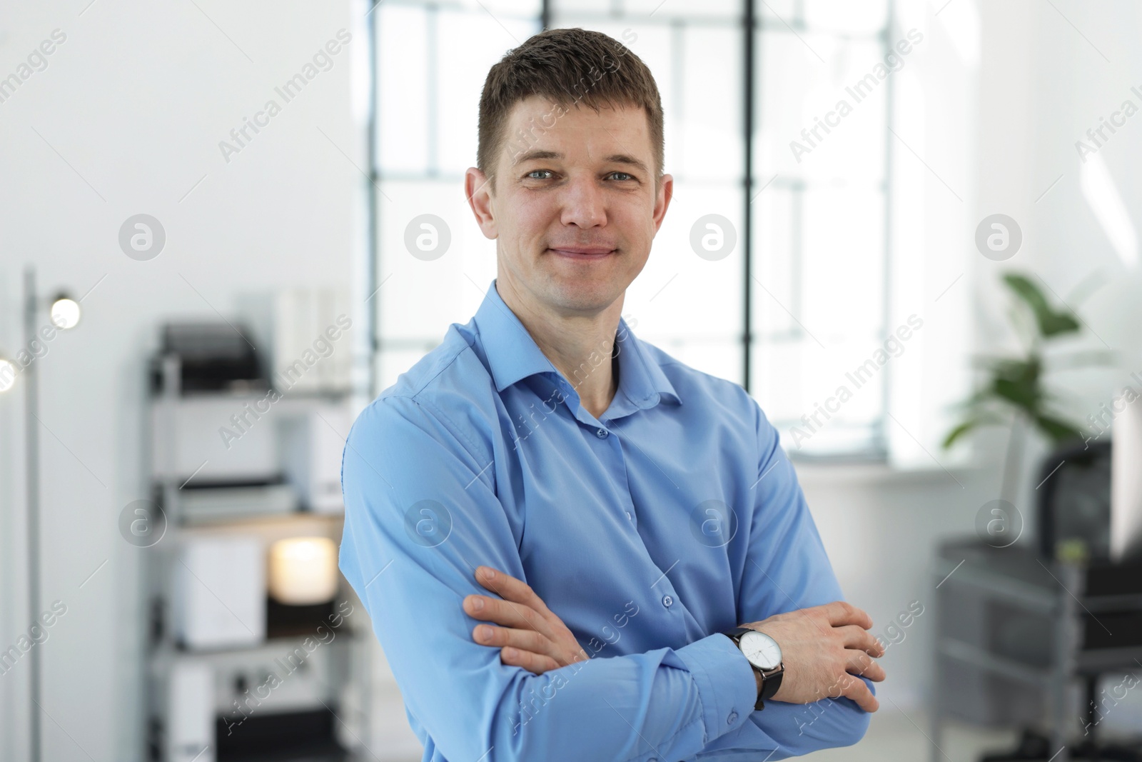 Portrait of handsome middle aged man in office Photo of Portrait of handsome middle aged man in office