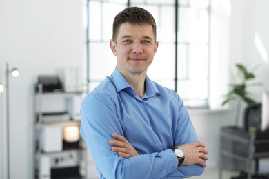 Photo of Portrait of handsome middle aged man in office