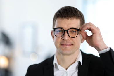 Photo of Portrait of handsome middle aged man indoors
