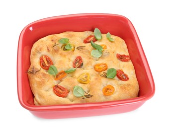 Photo of Delicious focaccia with tomatoes and spices in baking dish isolated on white