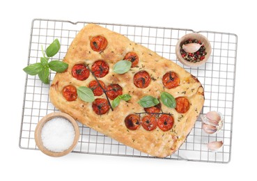 Photo of Delicious focaccia with tomatoes and spices isolated on white, top view