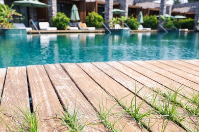Photo of Outdoor swimming pool with wooden deck at resort