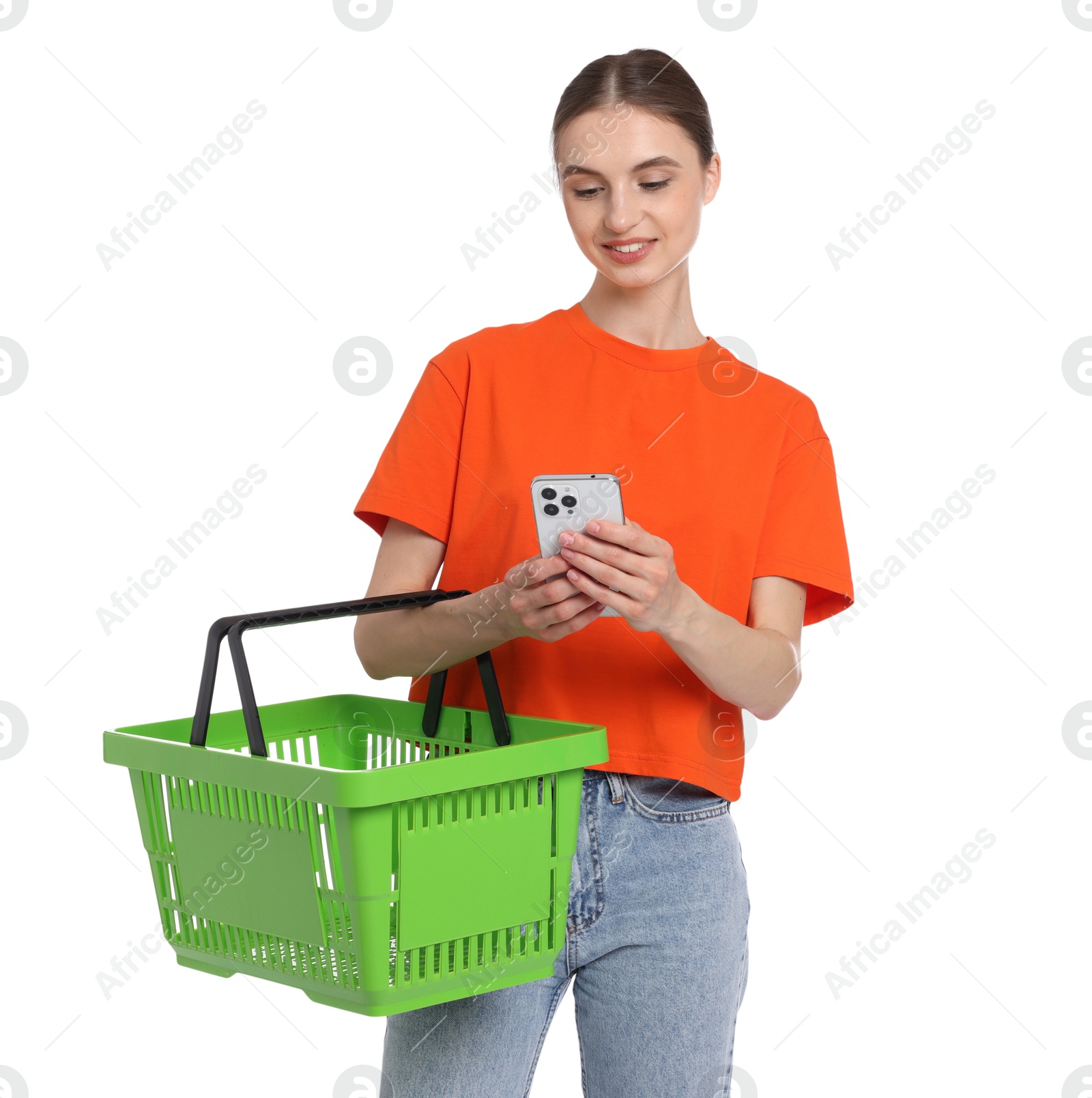 Photo of Woman with plastic shopping basket and smartphone on white background