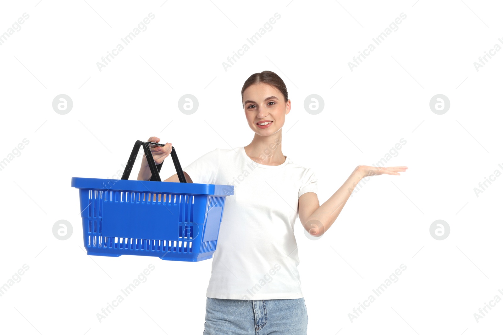 Woman with plastic shopping basket showing something on white background Photo of Woman with plastic shopping basket showing something on white background