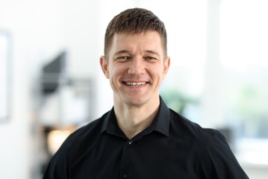 Photo of Portrait of handsome middle aged man indoors