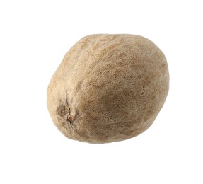 Photo of One whole nutmeg in air isolated on white