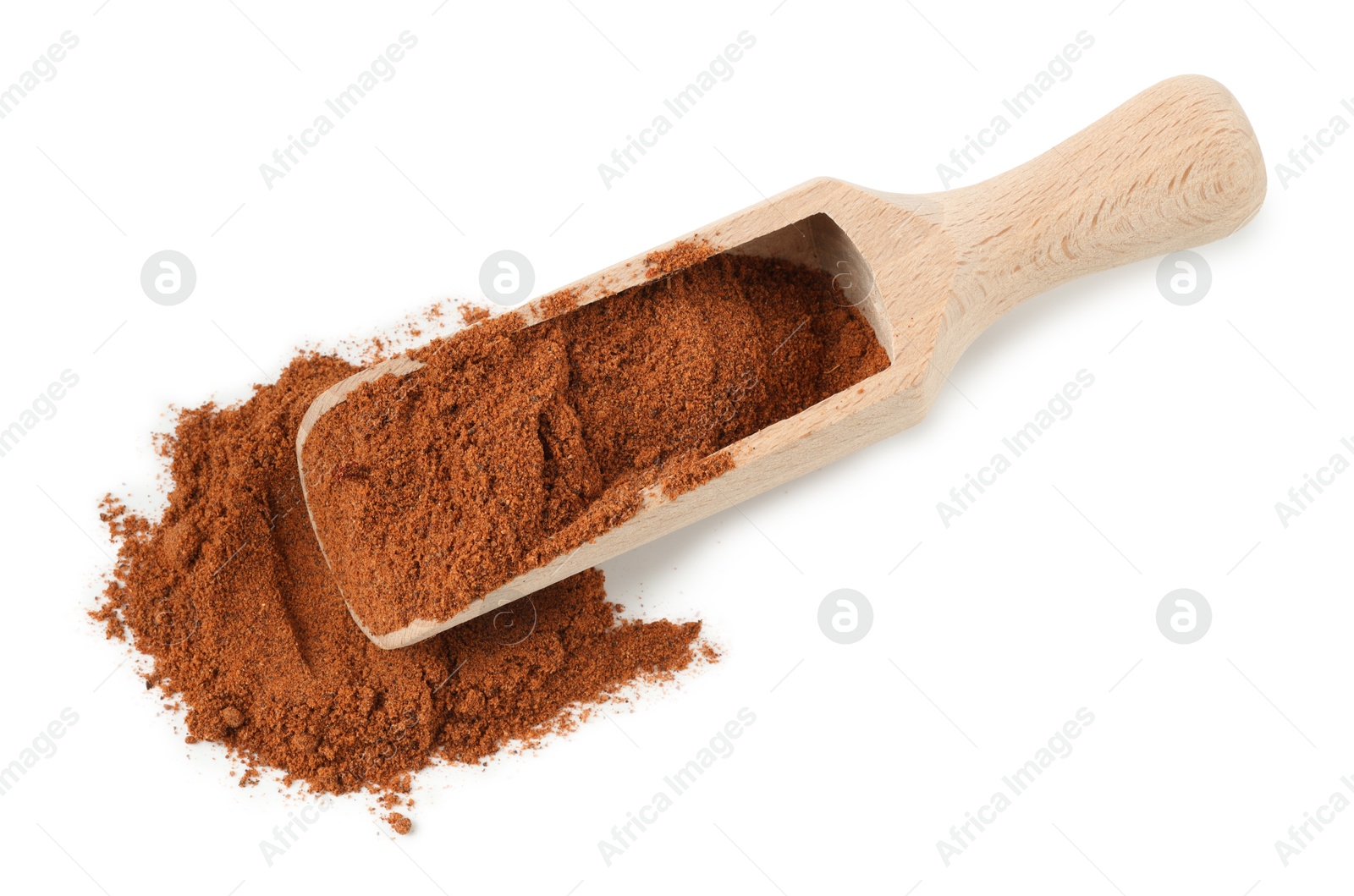 Nutmeg powder in scoop isolated on white, above view Photo of Nutmeg powder in scoop isolated on white, above view