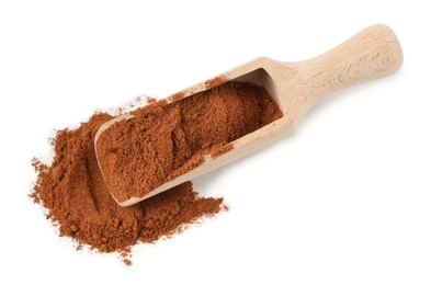 Photo of Nutmeg powder in scoop isolated on white, above view