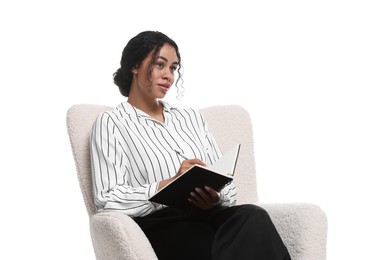 Photo of Professional psychologist with notebook and pen in armchair on white background