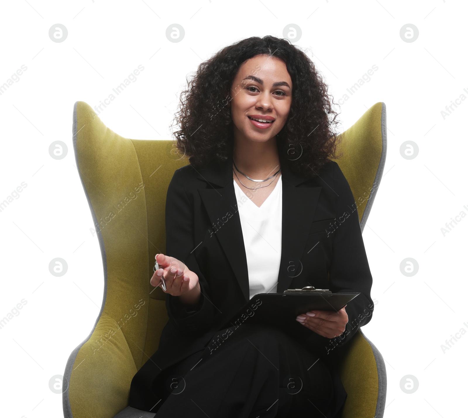 Professional psychologist with clipboard and pen in armchair on white background Photo of Professional psychologist with clipboard and pen in armchair on white background