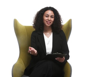 Photo of Professional psychologist with clipboard and pen in armchair on white background