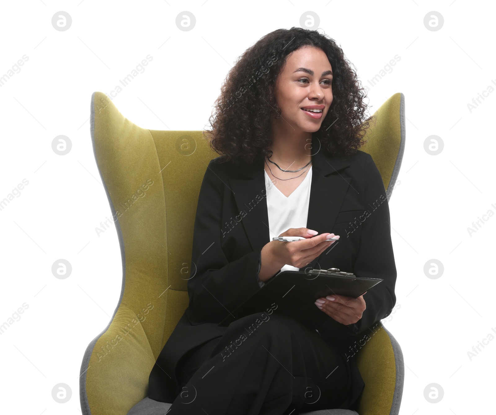 Professional psychologist with clipboard and pen in armchair on white background Photo of Professional psychologist with clipboard and pen in armchair on white background