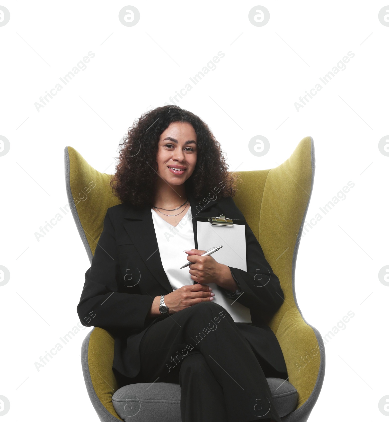 Professional psychologist with clipboard and pen in armchair on white background Photo of Professional psychologist with clipboard and pen in armchair on white background
