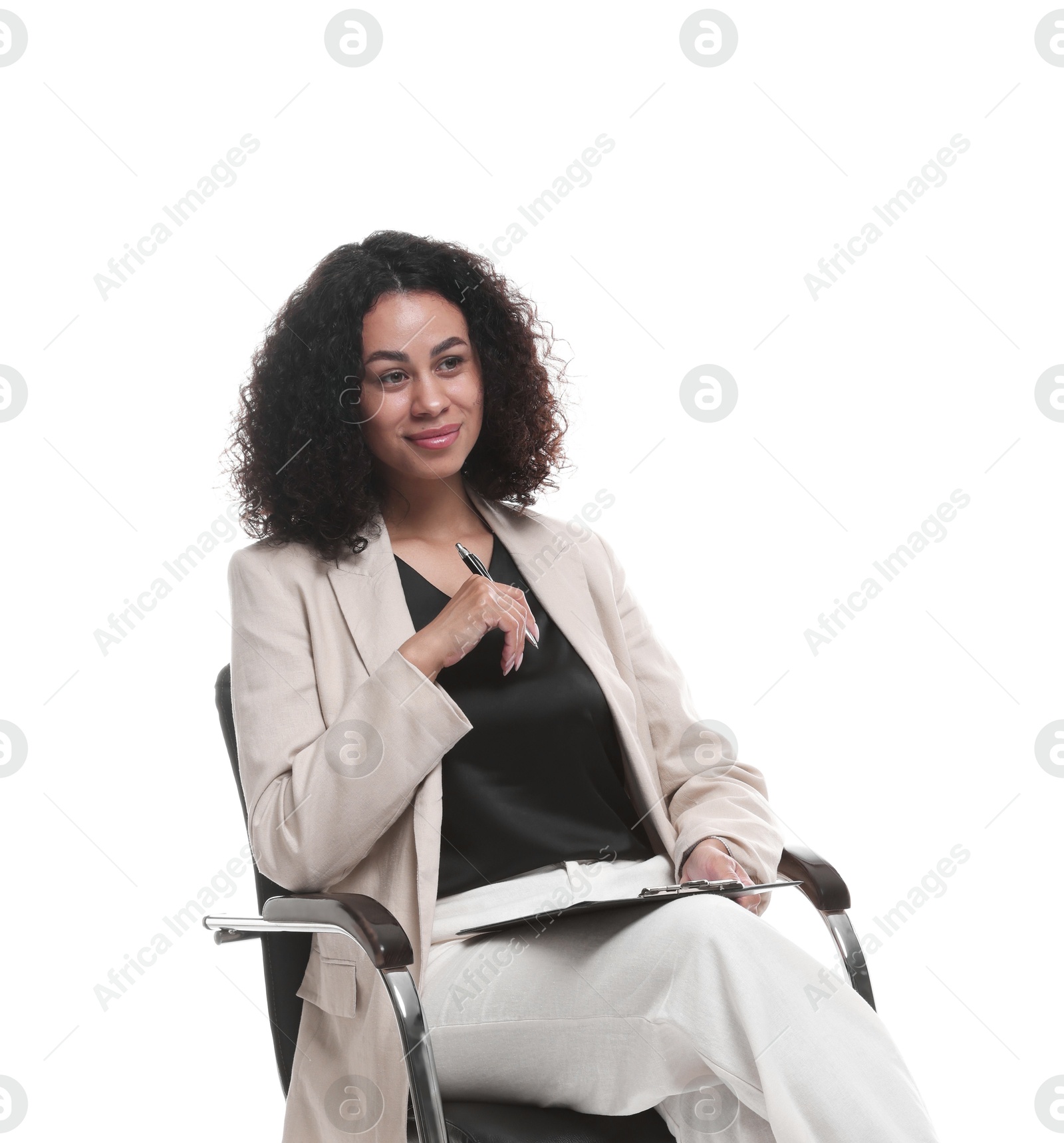 Professional psychologist with clipboard and pen in office chair on white background Photo of Professional psychologist with clipboard and pen in office chair on white background