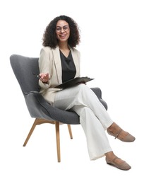 Photo of Professional psychologist with clipboard and pen in armchair on white background
