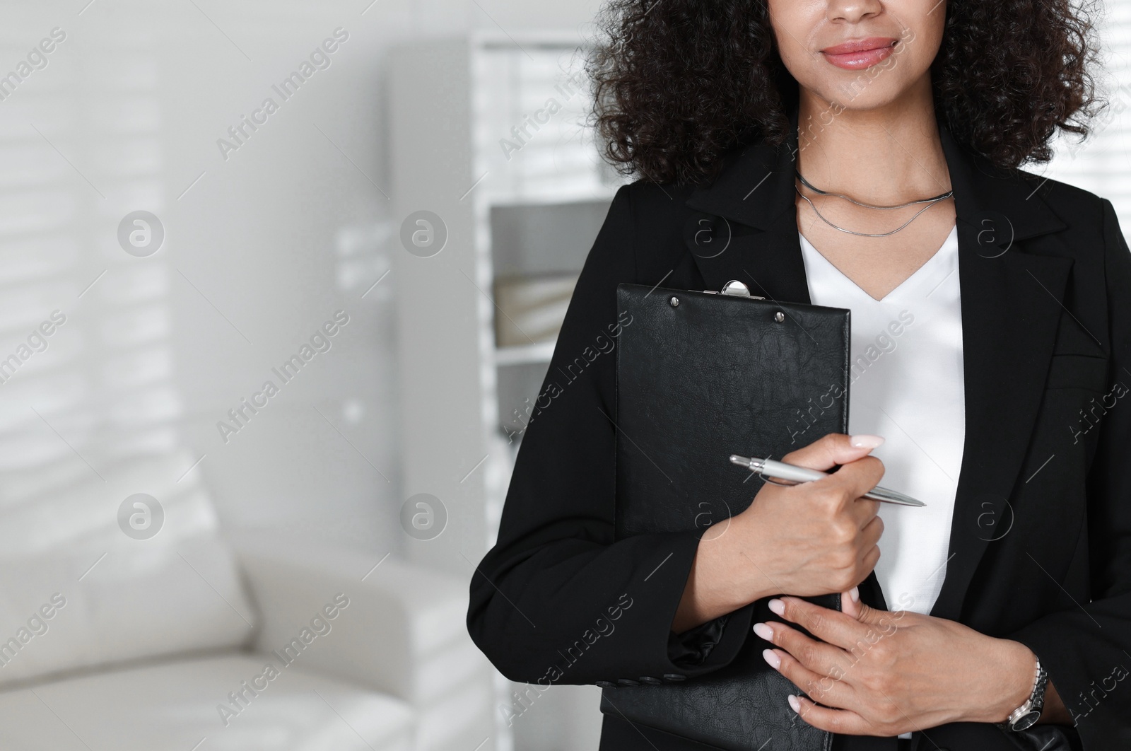 Professional psychologist with clipboard and pen in office, closeup. Space for text Photo of Professional psychologist with clipboard and pen in office, closeup. Space for text