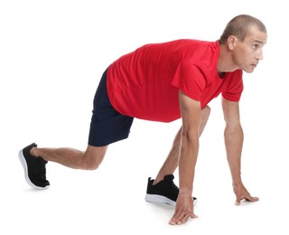 Photo of Runner in starting position on white background