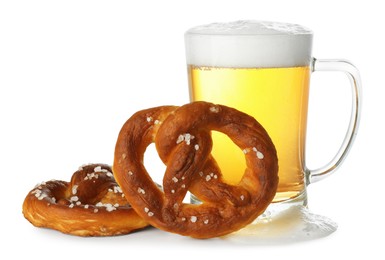 Photo of Tasty pretzels and glass of beer isolated on white