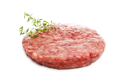 Photo of Fresh raw patty for burger and thyme isolated on white