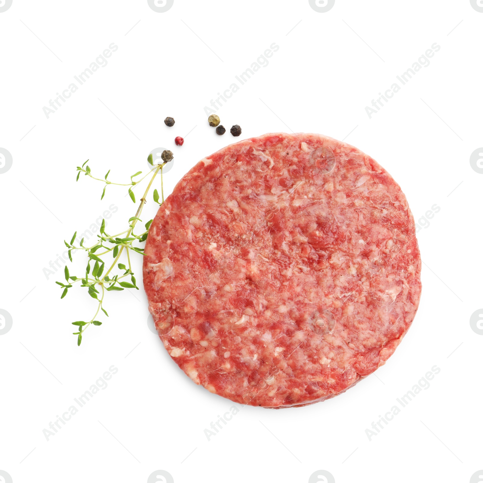 Fresh raw patty for burger and spices isolated on white, top view Photo of Fresh raw patty for burger and spices isolated on white, top view