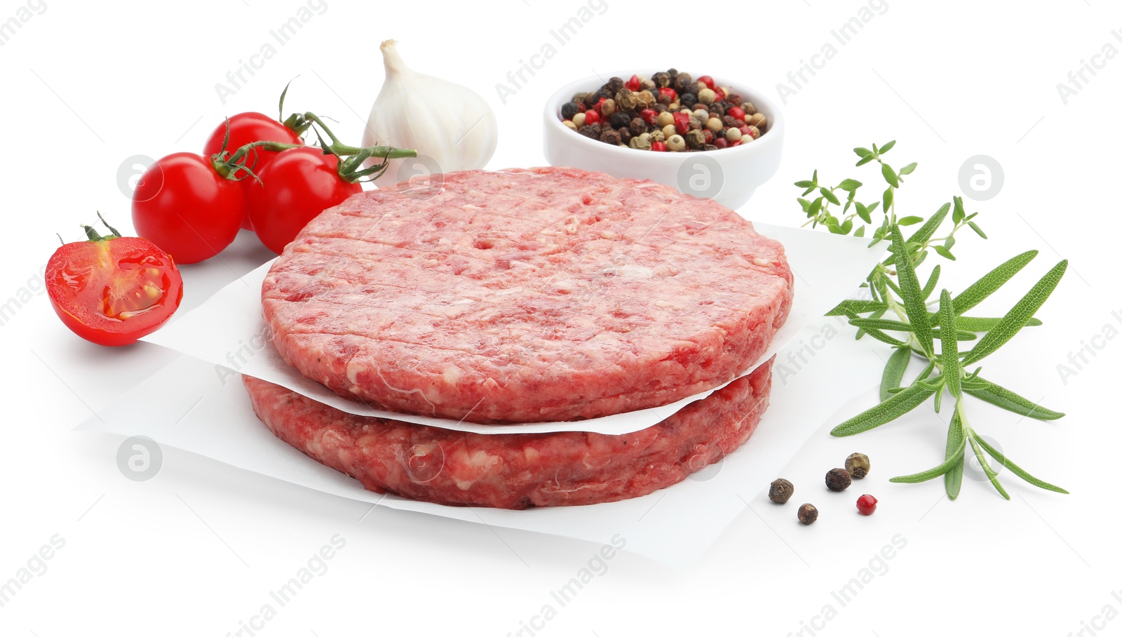Fresh raw patties for burger, tomatoes and spices isolated on white Photo of Fresh raw patties for burger, tomatoes and spices isolated on white