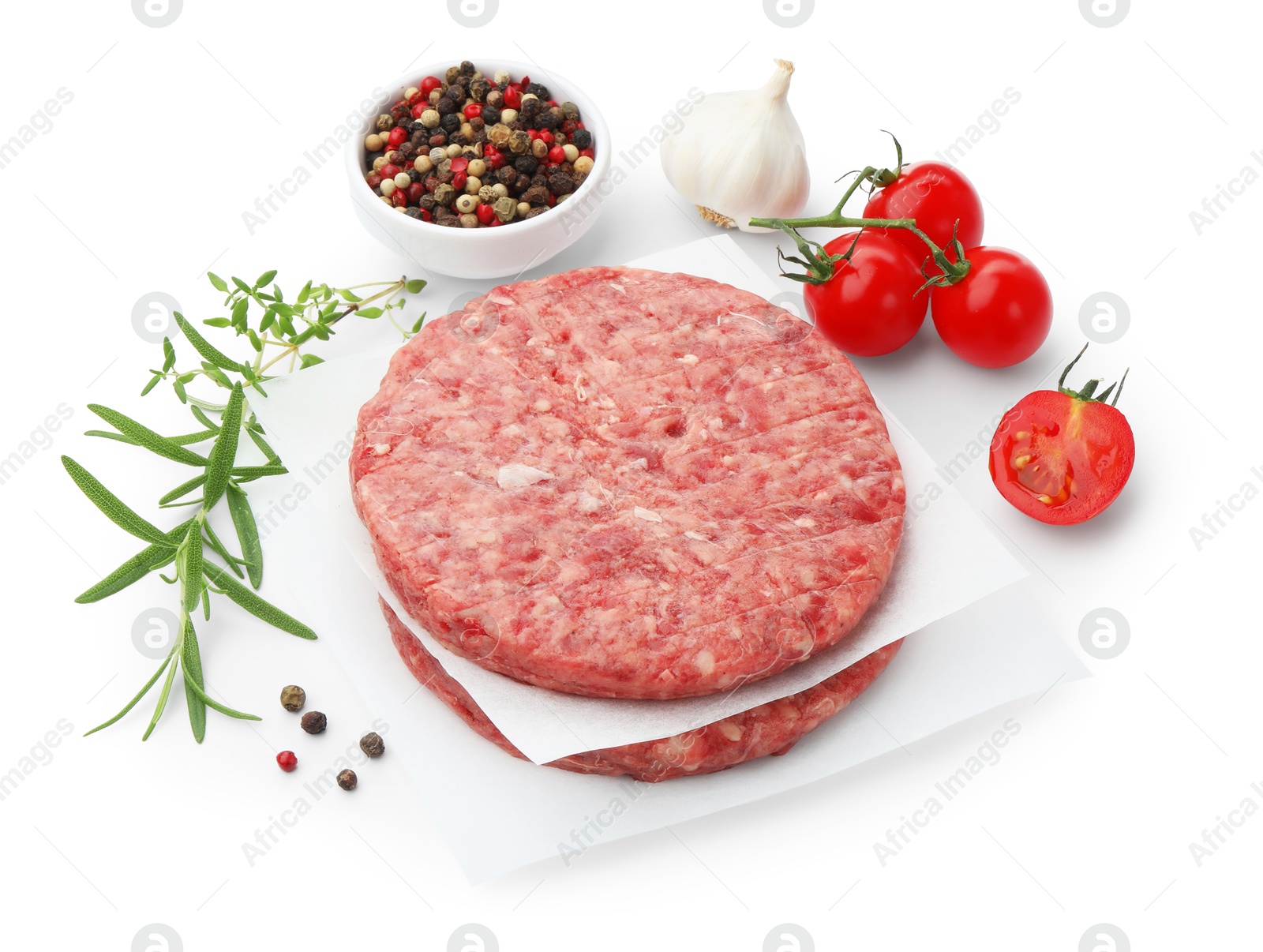 Fresh raw patties for burger, tomatoes and spices isolated on white Photo of Fresh raw patties for burger, tomatoes and spices isolated on white