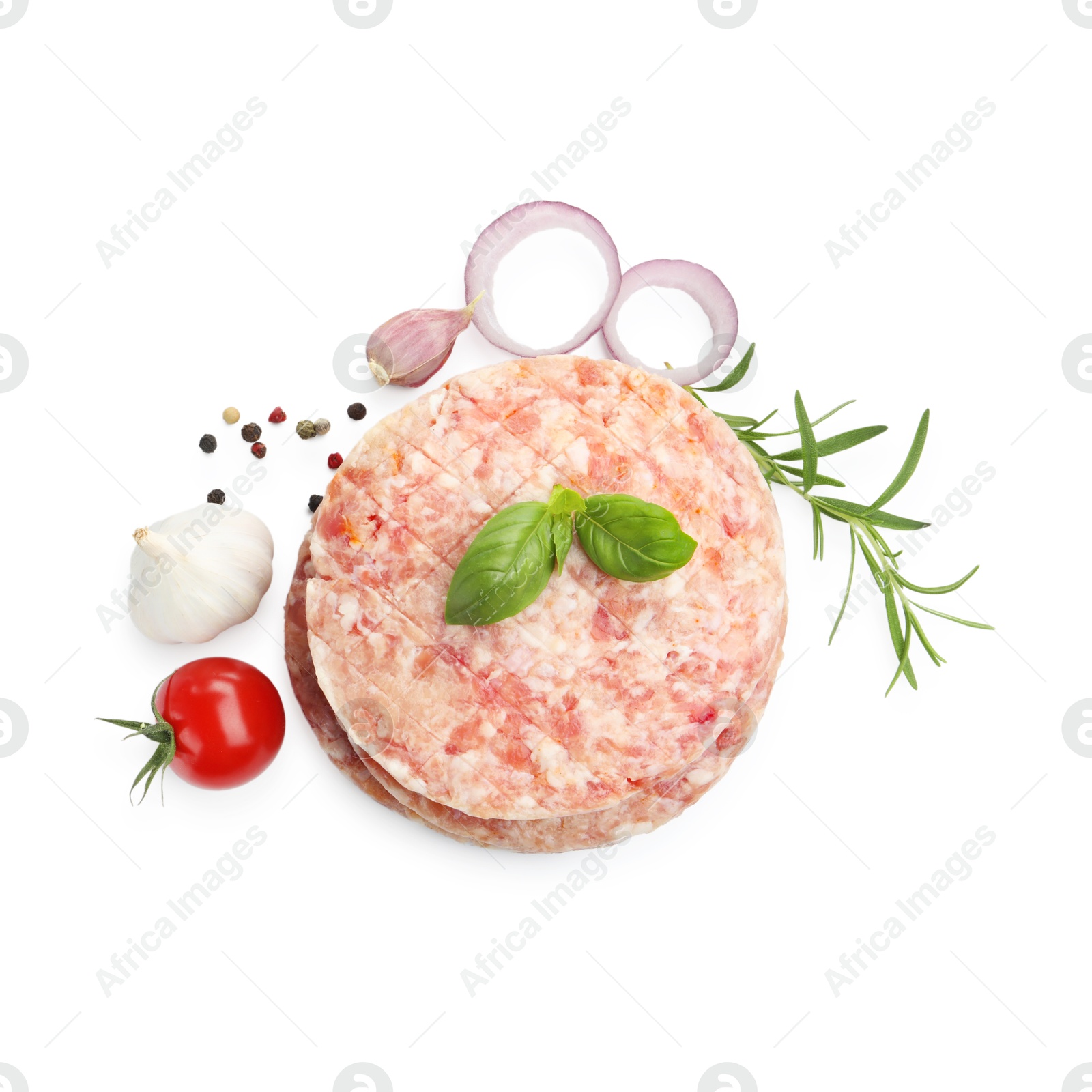 Fresh raw patties for burger, tomato and spices isolated on white, top view Photo of Fresh raw patties for burger, tomato and spices isolated on white, top view