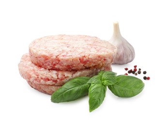 Photo of Fresh raw patties for burger and spices isolated on white