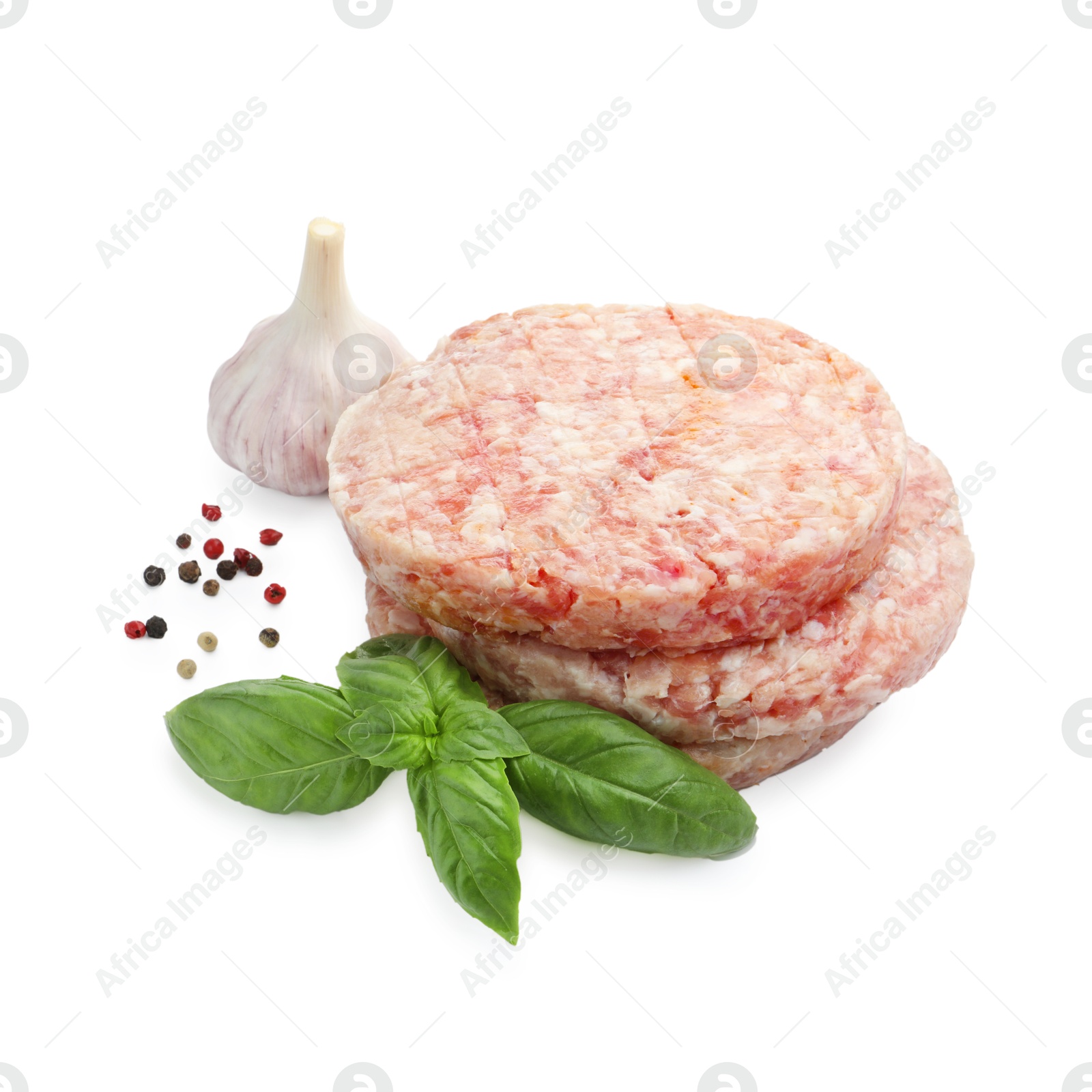 Fresh raw patties for burger and spices isolated on white Photo of Fresh raw patties for burger and spices isolated on white